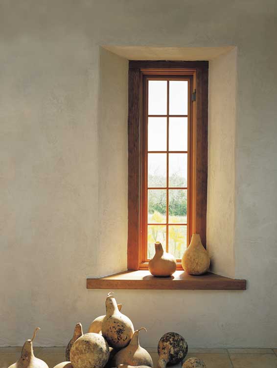 A favorite mini-view is the narrow casement window in the southeast bedroom, which catches the first morning sunlight and throws the bright shaft onto the opposite wall. Next to